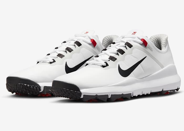View of white and black Nike golf shoes.